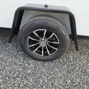 2026 ITI Cargo 6ft x 12ft Enclosed Cargo Trailer - Blackout Package, Black Aluminum Wheels - wheel and axle detail